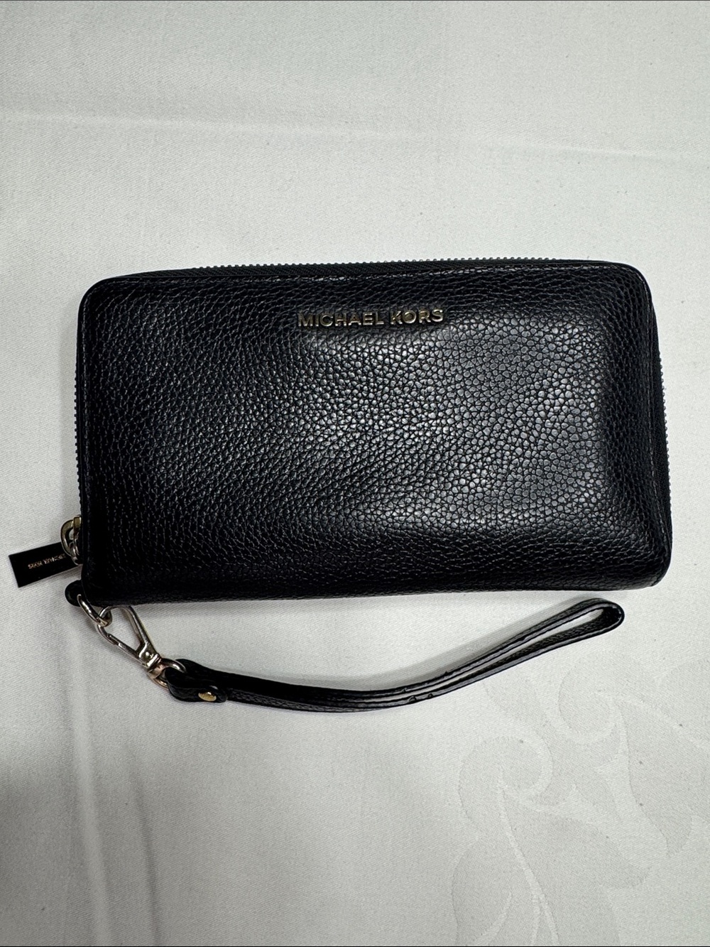 EUC Michael Kors black wristlet.